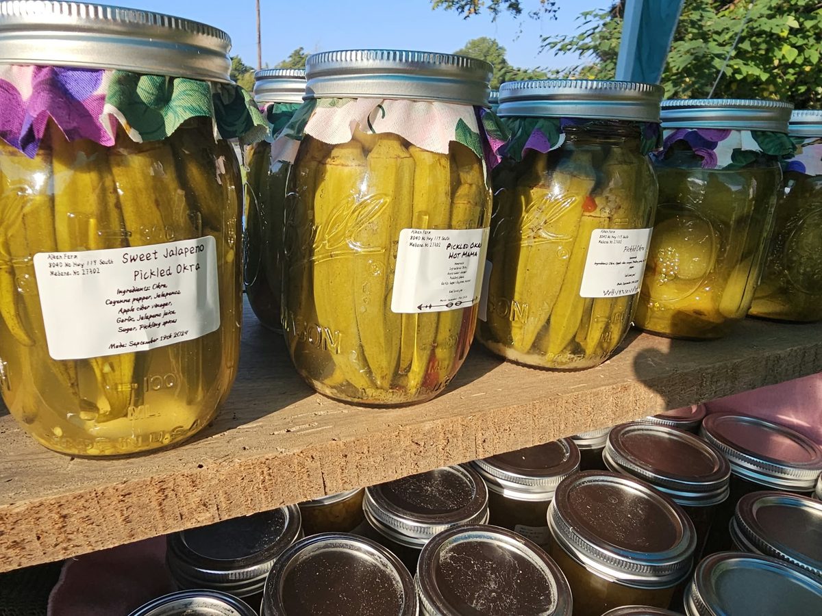Jars of pickled okra on a board